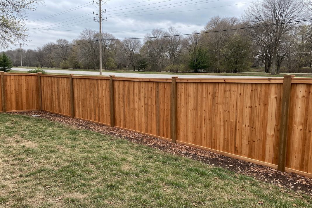 An illustrative image of a finished tall wood acoustic-style fence
