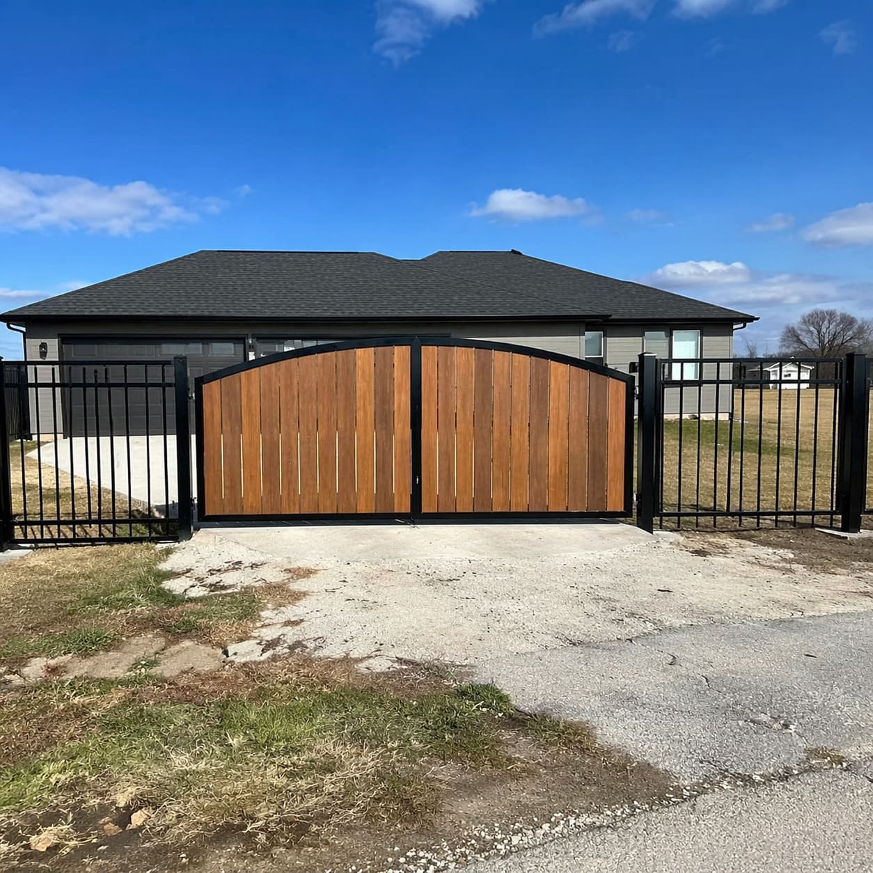 Driveway Gate – Arched timber and metal driveway gate for residential entrance - Sample Image