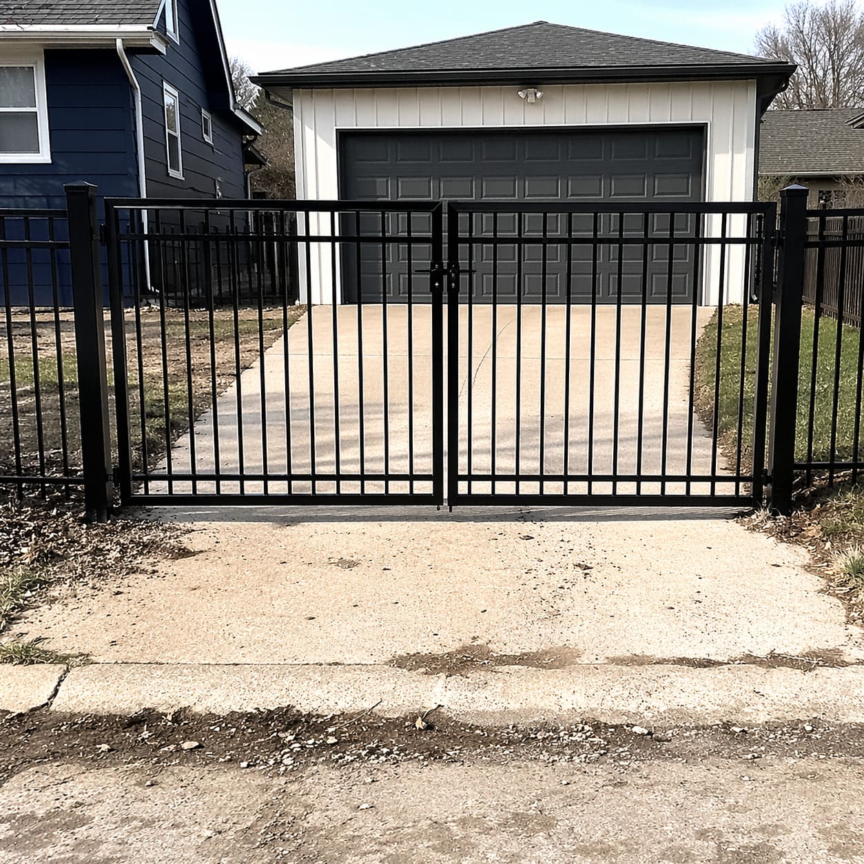 Driveway Gate – Black metal swing gate with vertical bars for residential driveway – Sample Image